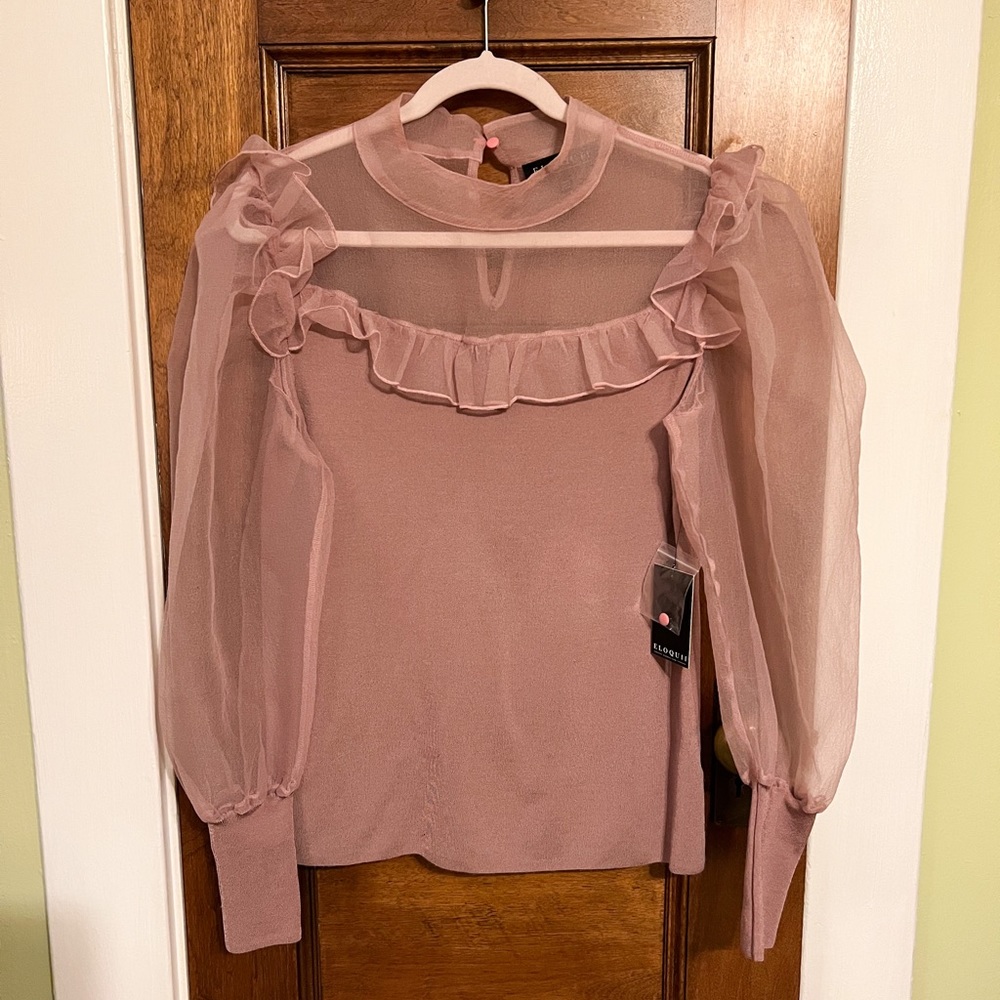 Dusty pink knit top.
